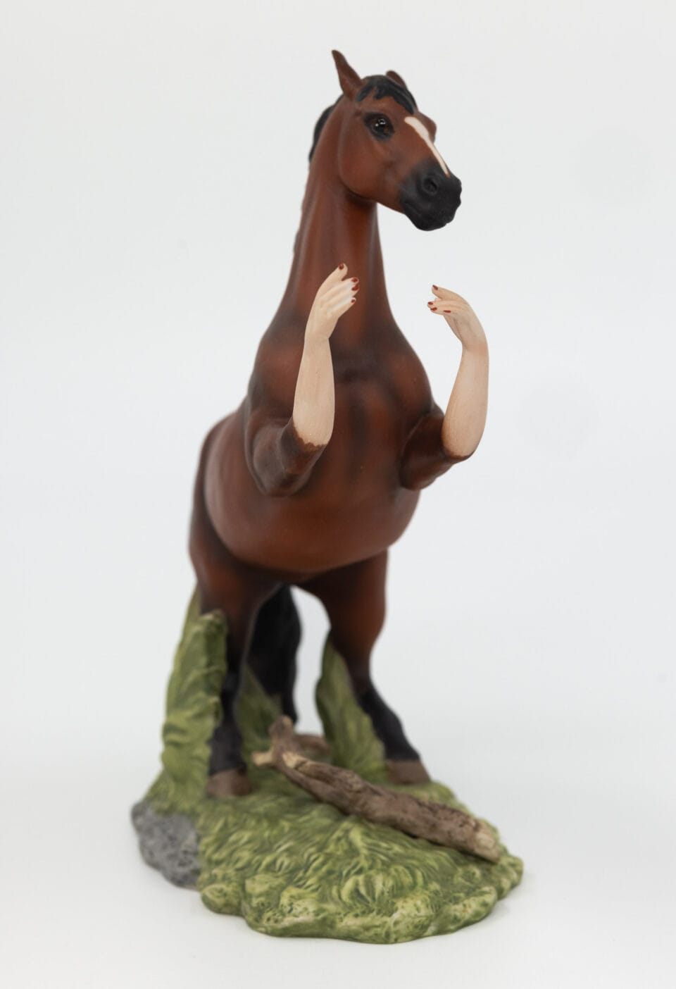 a reimagined secondhand ceramic kitsch piece of a horse with human arms